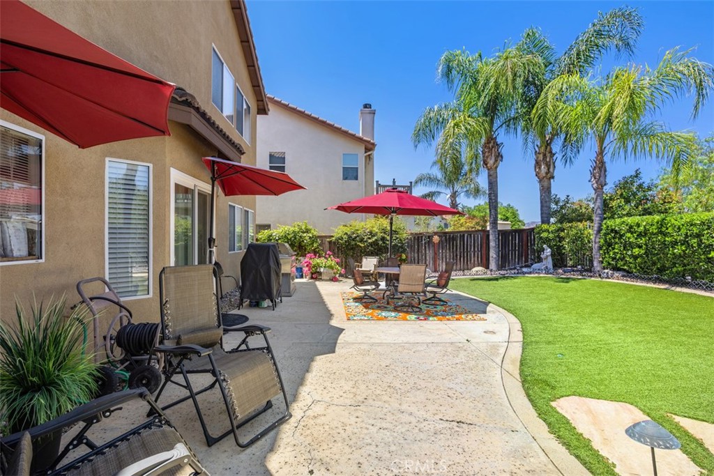 33370 Morning View Drive Temecula, CA 92592 - Photo 31 of 41 a view of a patio with a table and chairs under an umbrella