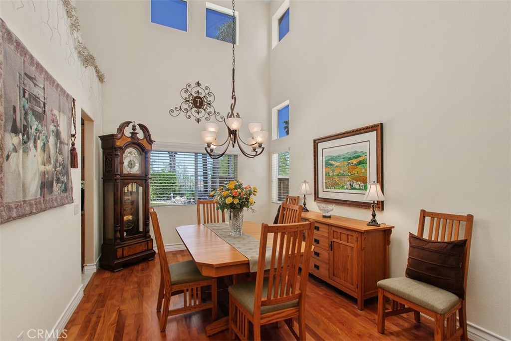 33370 Morning View Drive Temecula, CA 92592 - Photo 9 of 41 a view of a dining room with furniture and wooden floor