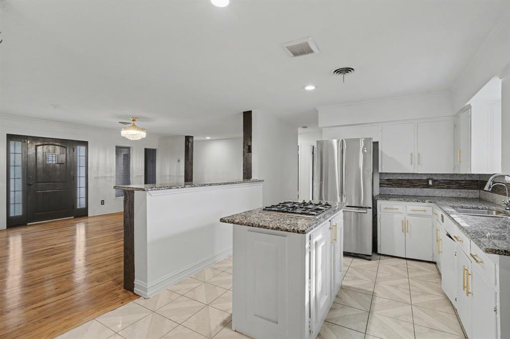 1714 East Union Bower Road Irving, TX 75061 - Photo 10 of 32 a kitchen with white cabinets and appliances