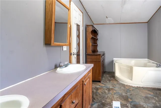 a bedroom with a bed closet and a window