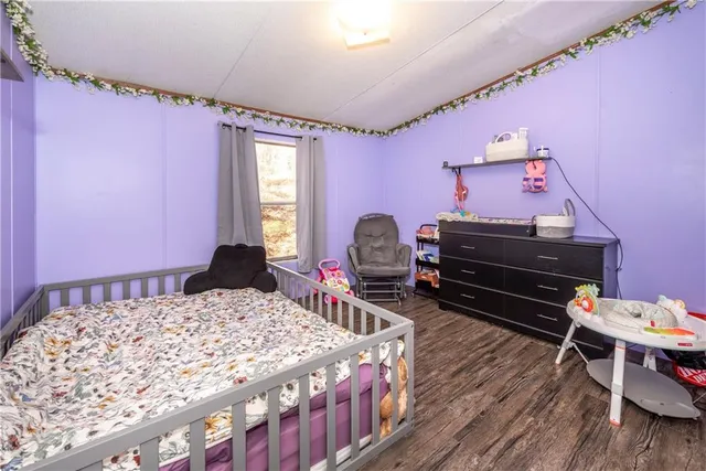 a backyard of a house with a bench yard tree and outdoor seating
