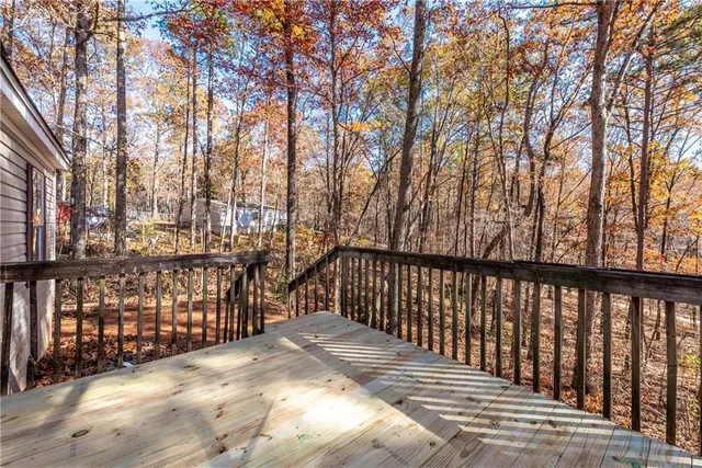 a view of a room with wooden floor and window