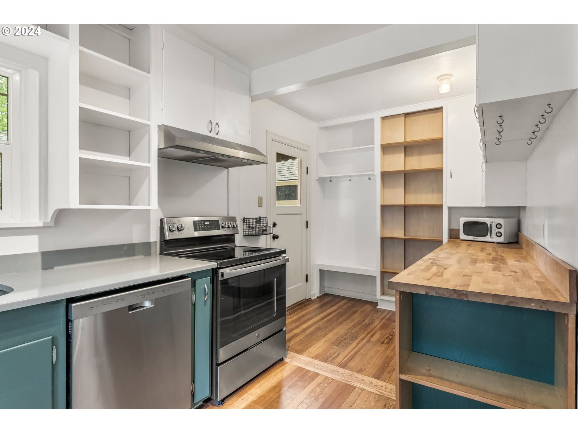 1343 West Broadway Eugene, OR 97402 - Photo 3 of 10 a kitchen with stainless steel appliances granite countertop a stove and a cabinets