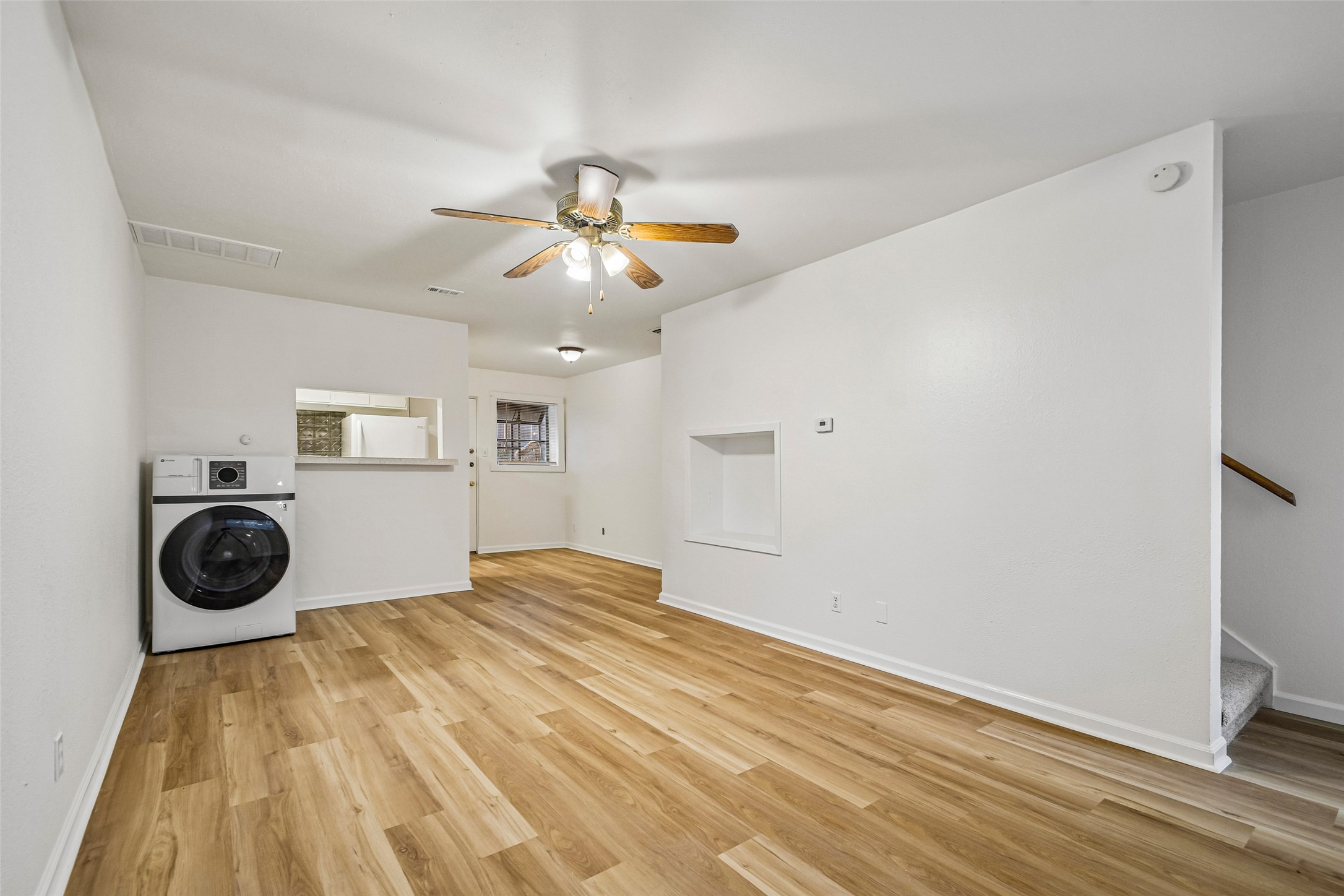 2413 Leon Street, Unit 104 Austin, TX 78705 - Photo 7 of 26 a view of a bedroom with a bed and cabinets