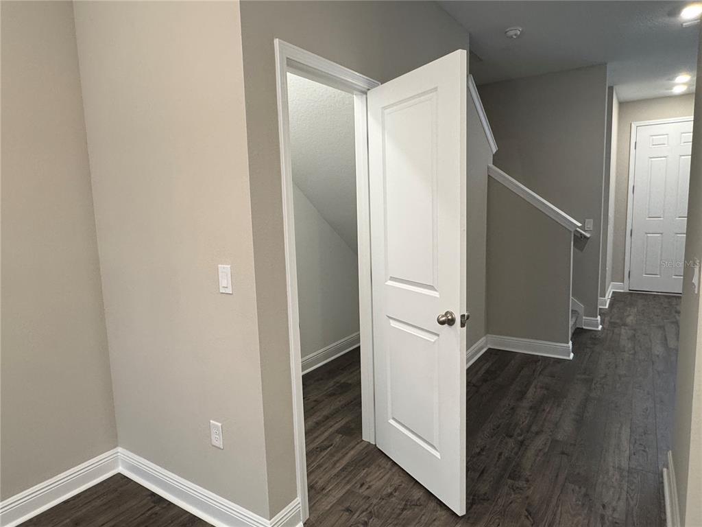 16434 Hamlin Hills Road Winter Garden, FL 34787 - Photo 14 of 50 an entryway with wooden floor and staircase