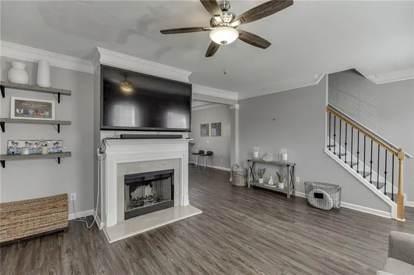 a living room with furniture and a flat screen tv