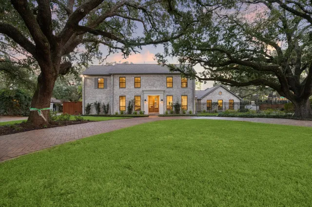 a view of house with a garden