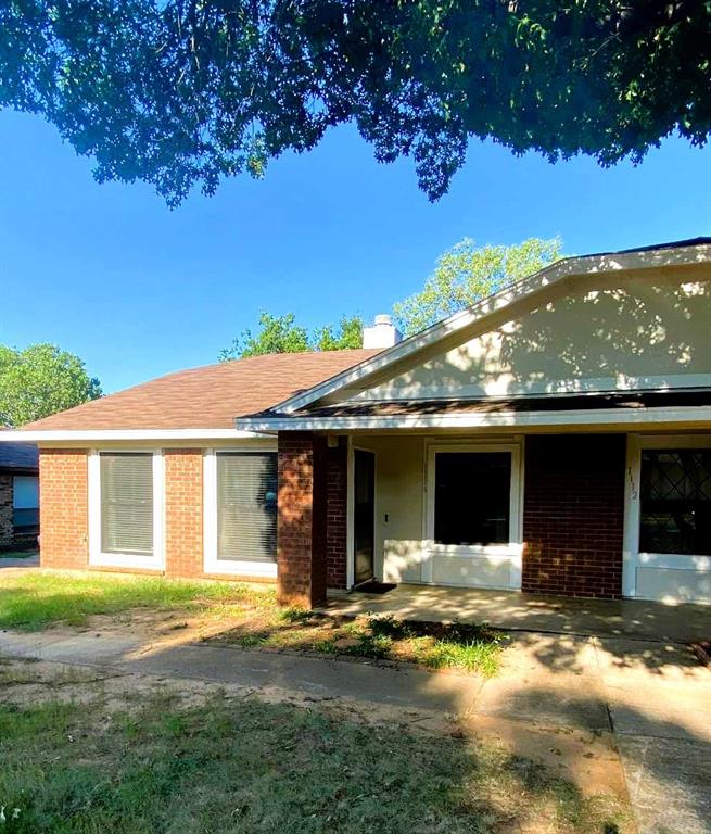 View of front facade featuring brick siding