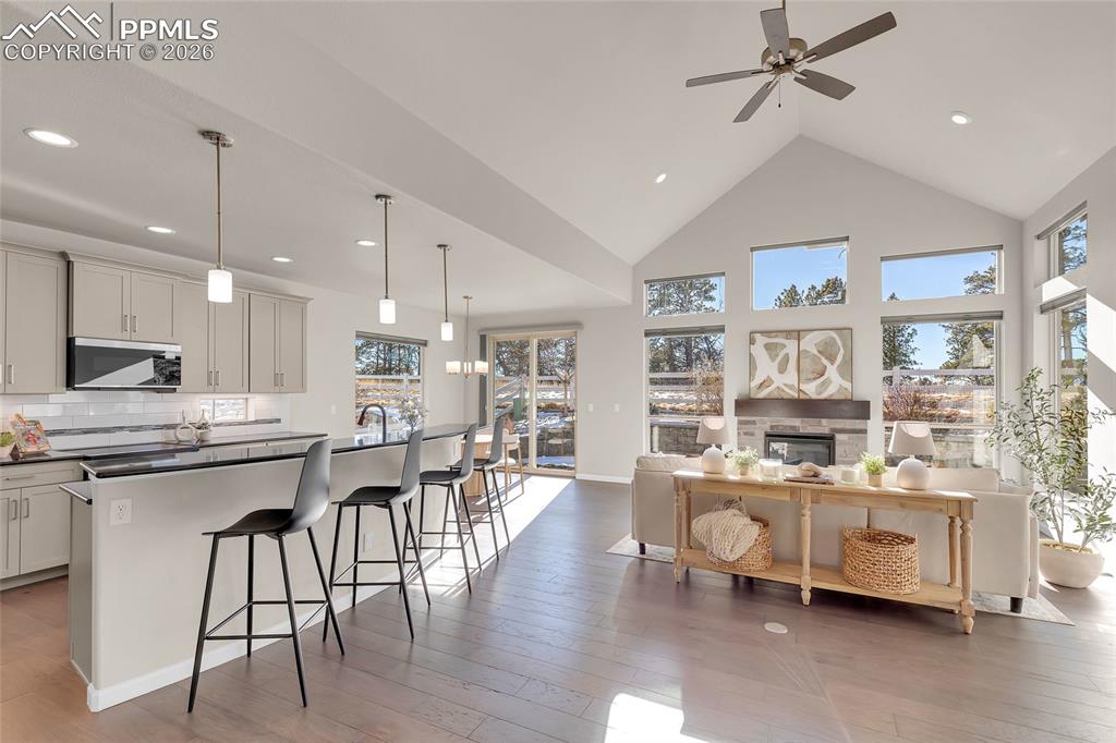 11830 Alydar Loop Colorado Springs, CO 80921 - Photo 3 of 37 a large kitchen with a table and chairs