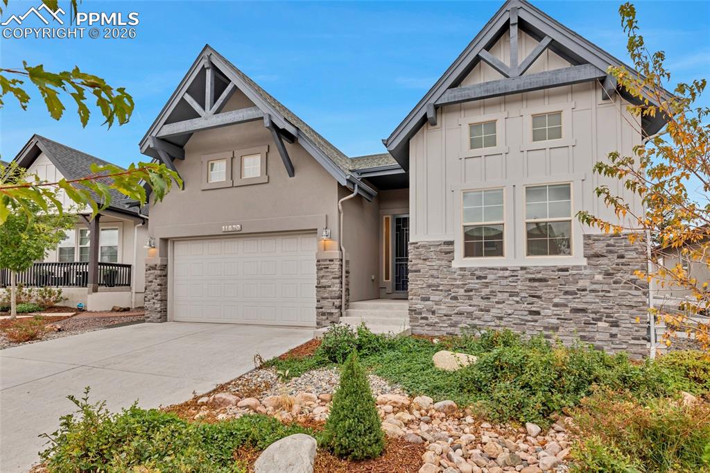 11830 Alydar Loop Colorado Springs, CO 80921 - Photo 35 of 37 a front view of a house with garden