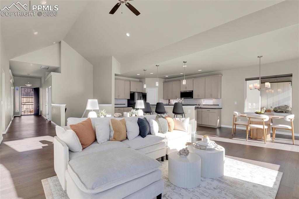 11830 Alydar Loop Colorado Springs, CO 80921 - Photo 7 of 37 a living room with furniture and kitchen view