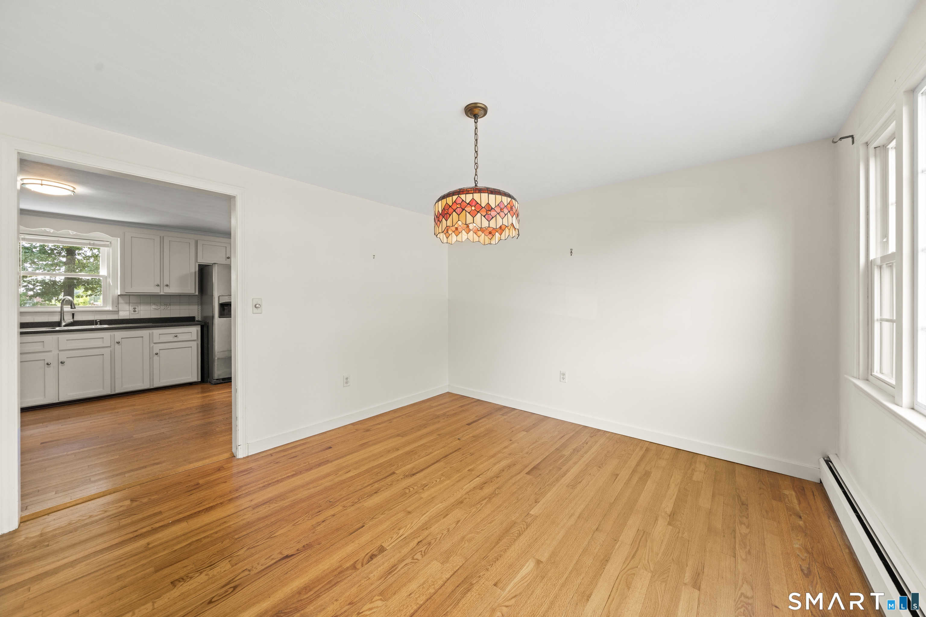 2 Sparkle Street Enfield, CT 06082 - Photo 11 of 32 Formal dining room with wood flooring