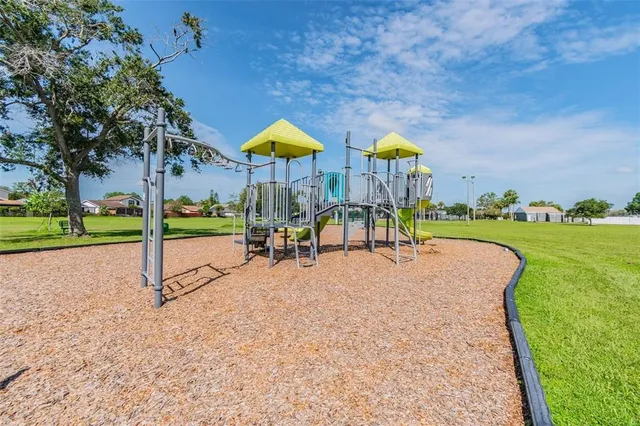 a view of a playground with basketball court