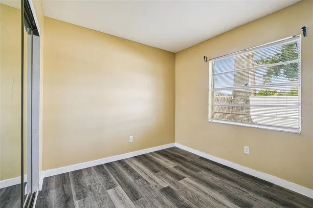 a view of a room with wooden floor and walls