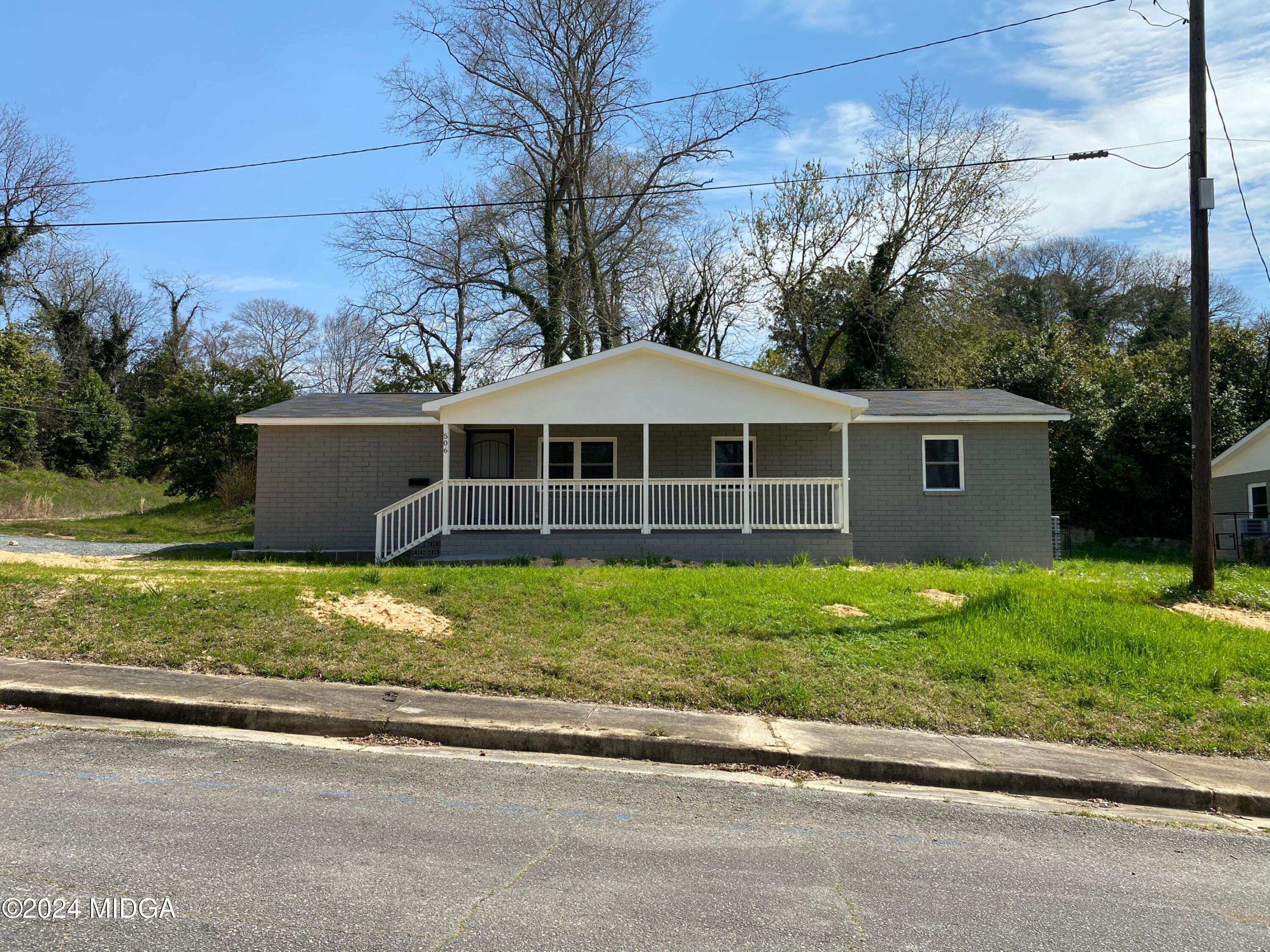 front view of a house with a yard