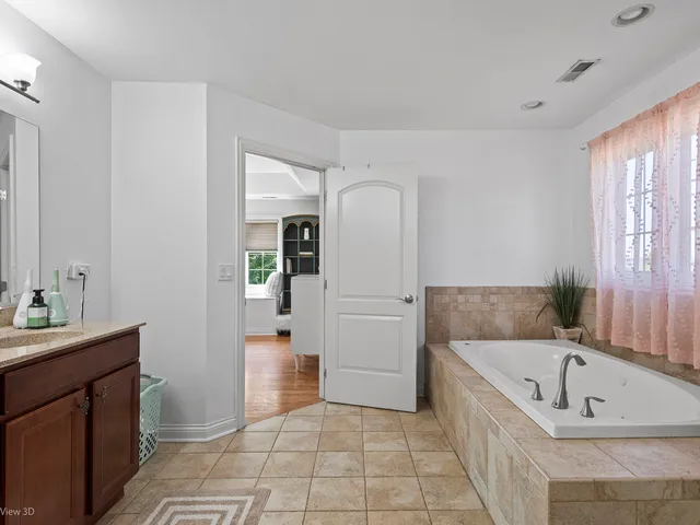 a bathroom with a bathtub and a sink