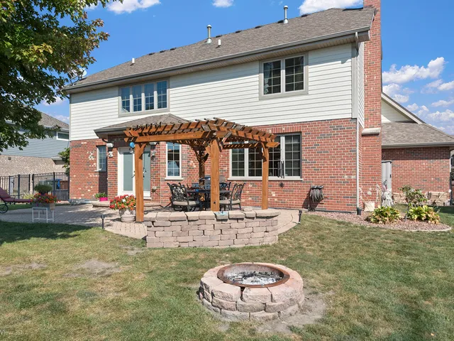 a view of a house with swimming pool and a porch