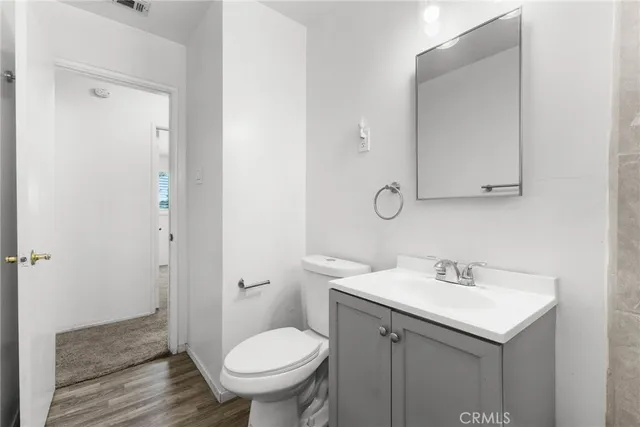 a bathroom with a sink toilet and vanity