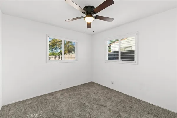 a room with window and a ceiling fan