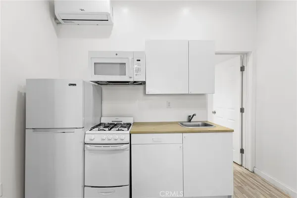 a kitchen with a sink and a refrigerator