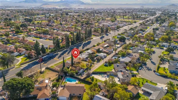 an aerial view of residential houses with outdoor space