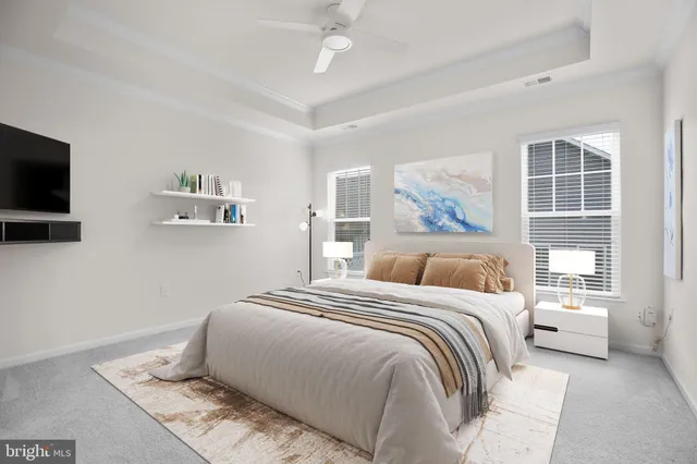 a bedroom with a large bed and a flat screen tv