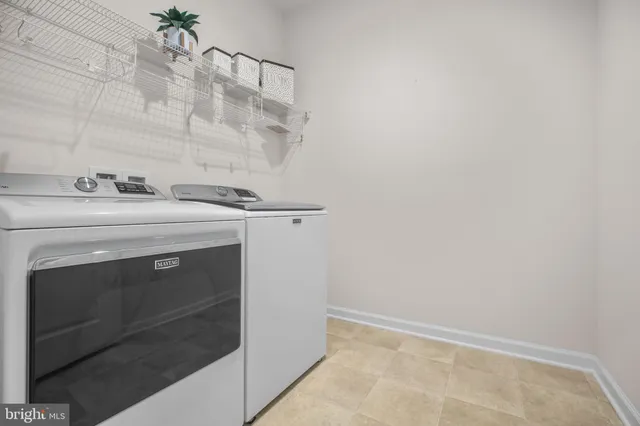 a view of a porch with a table and chairs