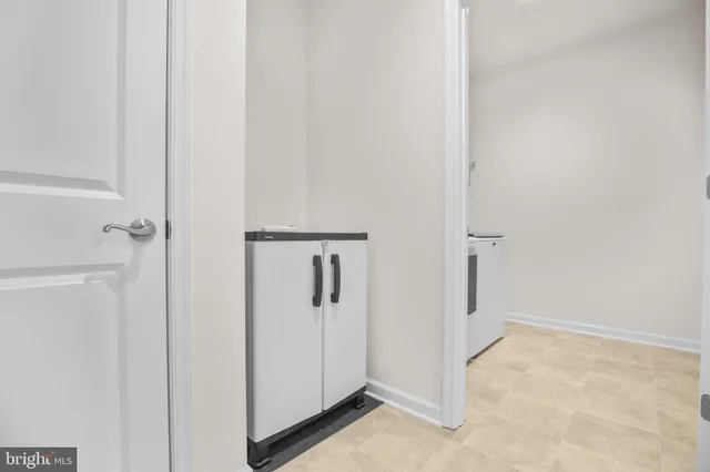 a view of a patio with a table and chairs