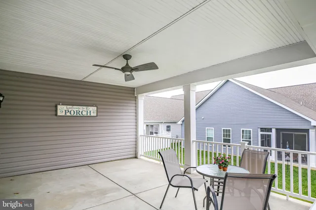 a view of a livingroom with furniture and a ceiling fan