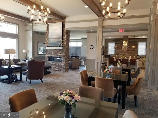 a view of a garden with sitting area