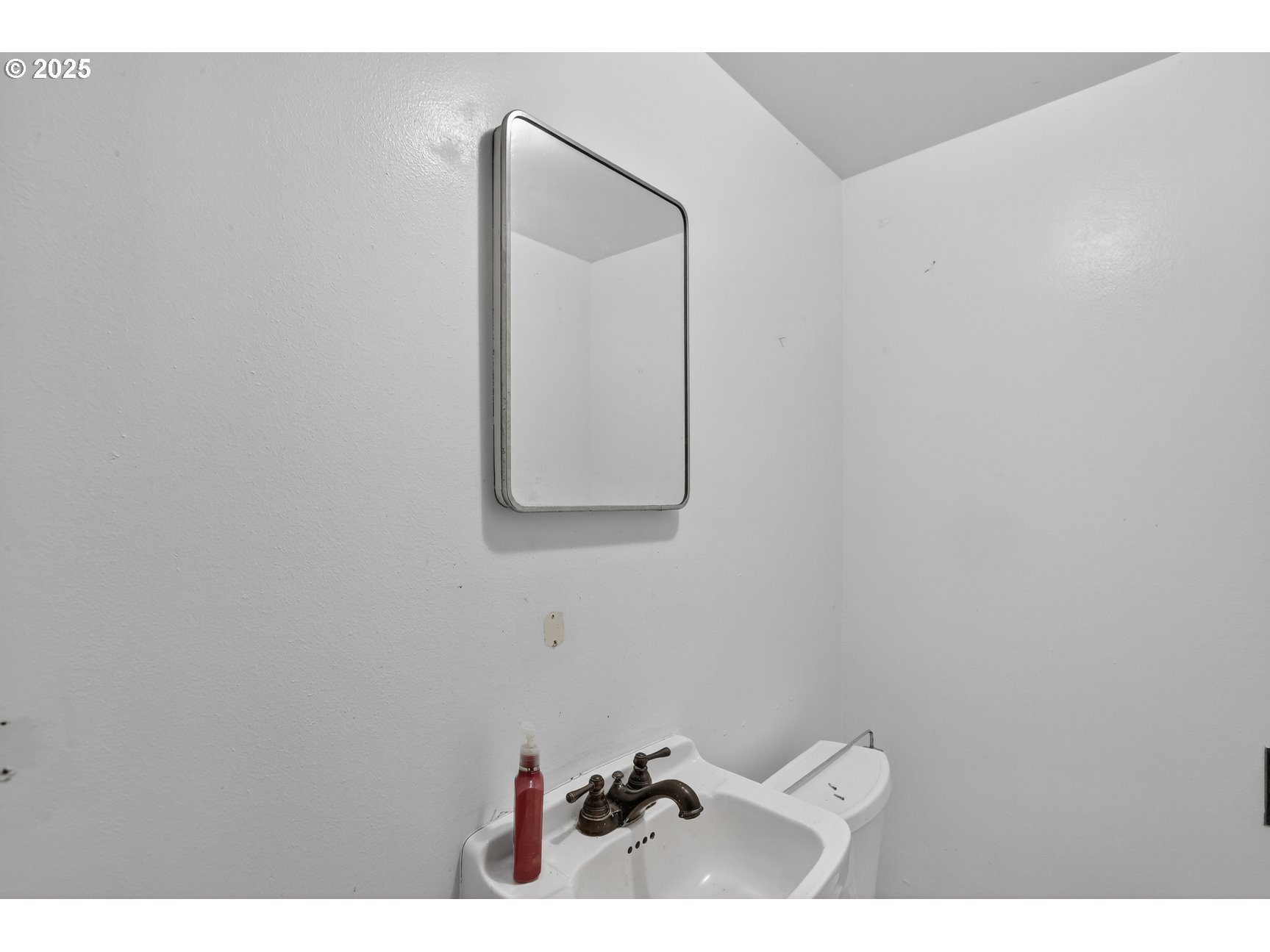 31444 New Kirk Road Scappoose, OR 97056 - Photo 26 of 43 a bathroom with a toilet mirror and vanity