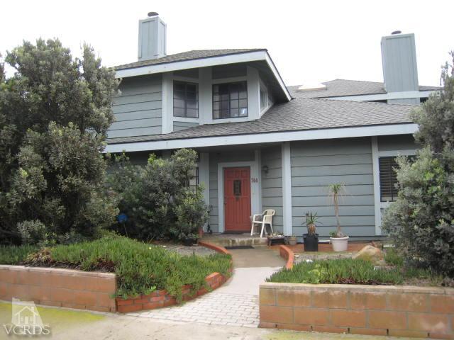 744 Mandalay Beach Road Oxnard, CA 93035 - Photo 1 of 6 a front view of a house with garden
