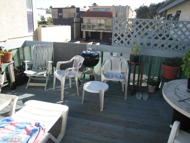744 Mandalay Beach Road Oxnard, CA 93035 - Photo 3 of 6 a view of a patio with table and chairs and potted plants