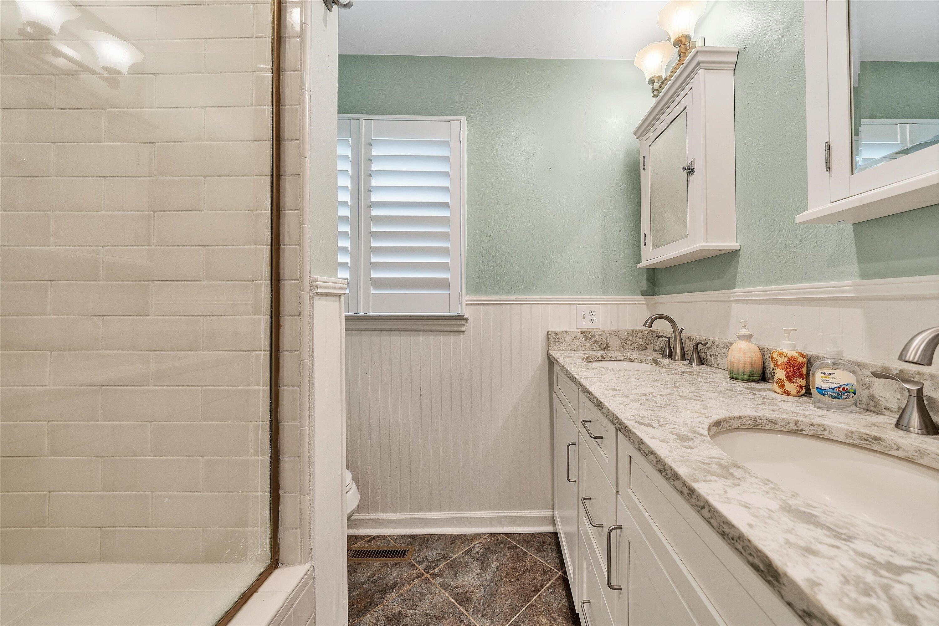 259 Brooks Point Lane Union Hall, VA 24176 - Photo 20 of 59 a bathroom with a granite countertop sink and a mirror