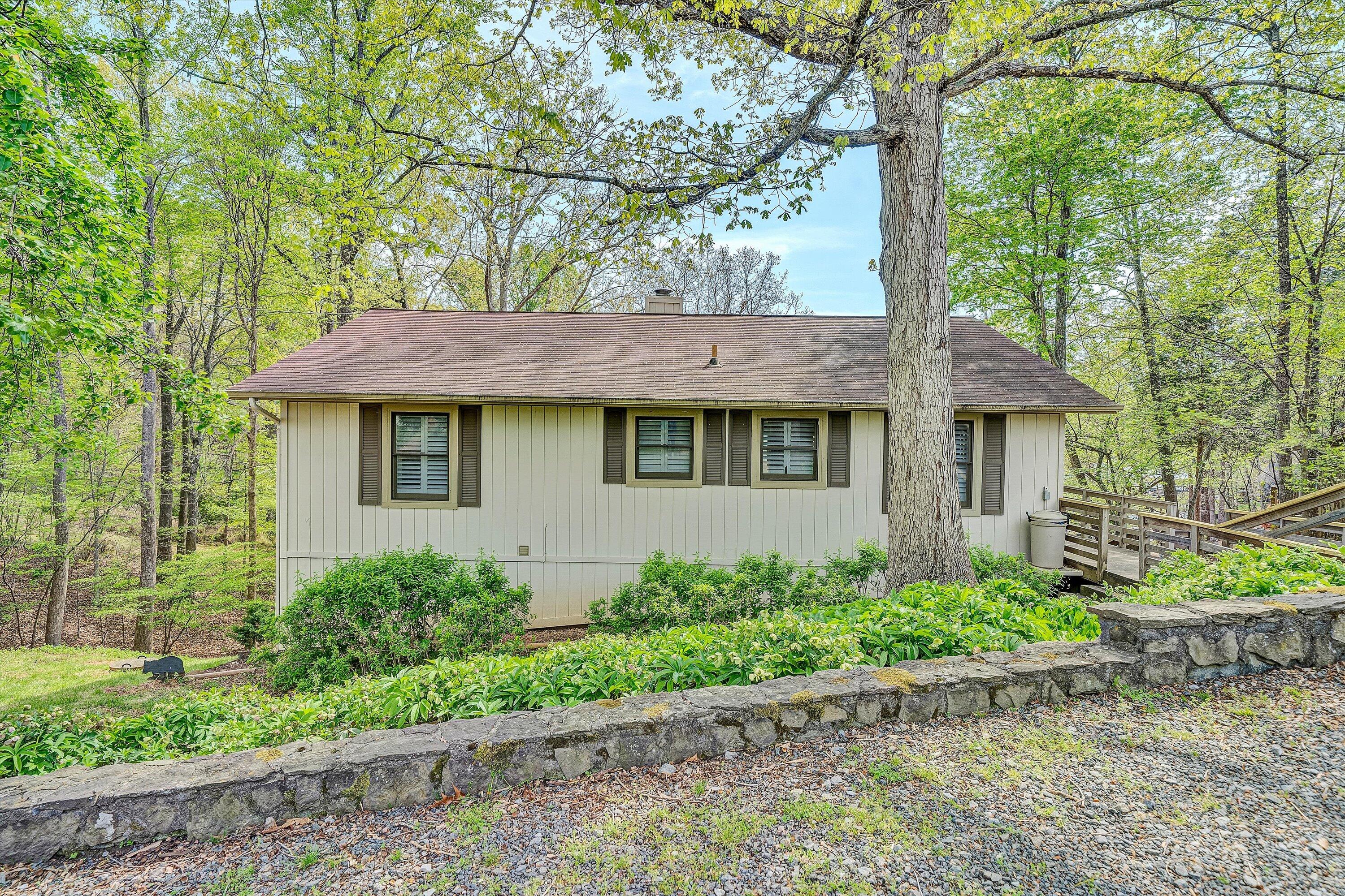 259 Brooks Point Lane Union Hall, VA 24176 - Photo 2 of 59 a view of a house with a yard plants and large trees