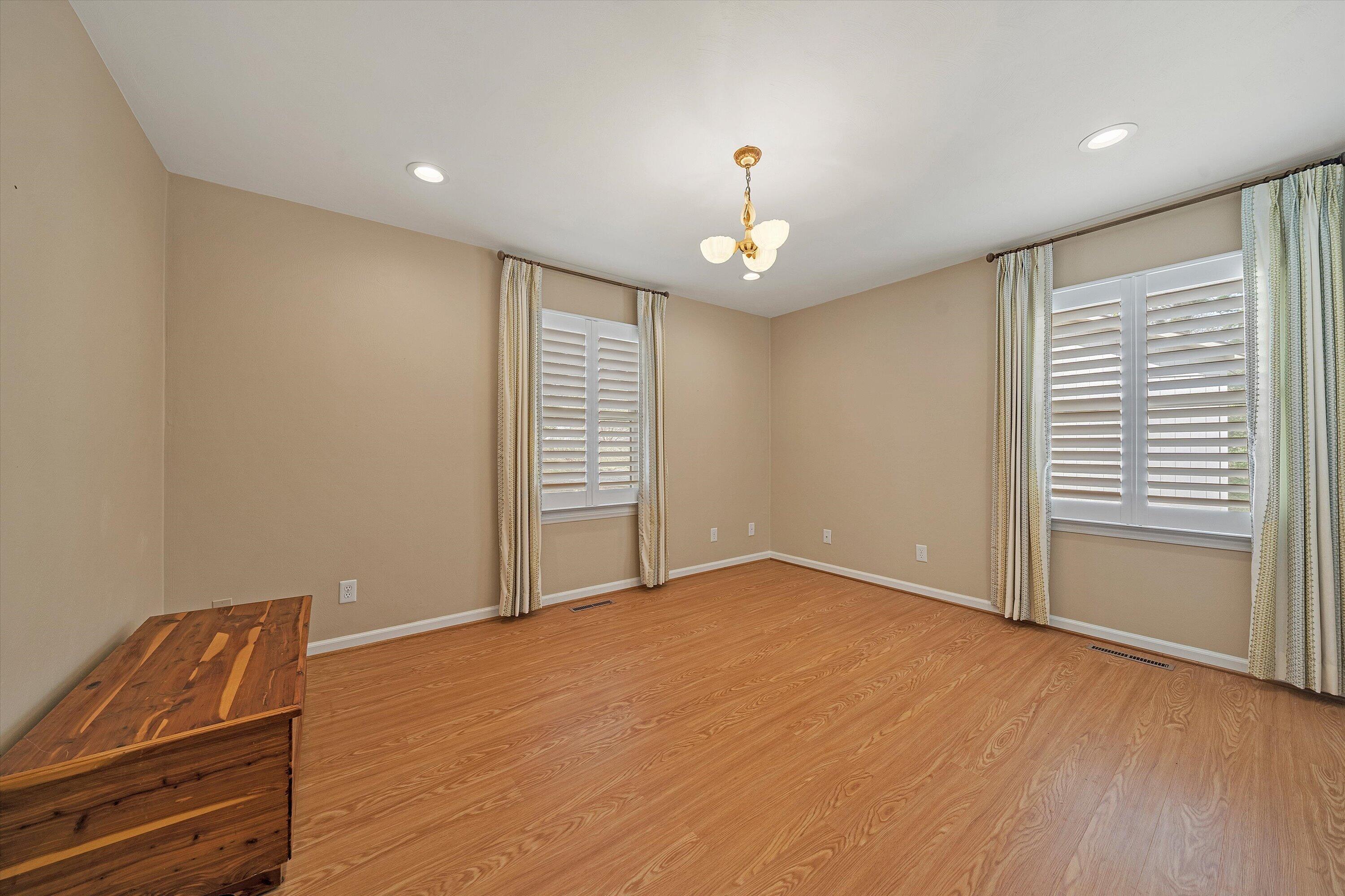 259 Brooks Point Lane Union Hall, VA 24176 - Photo 21 of 59 an empty room with wooden floor and windows