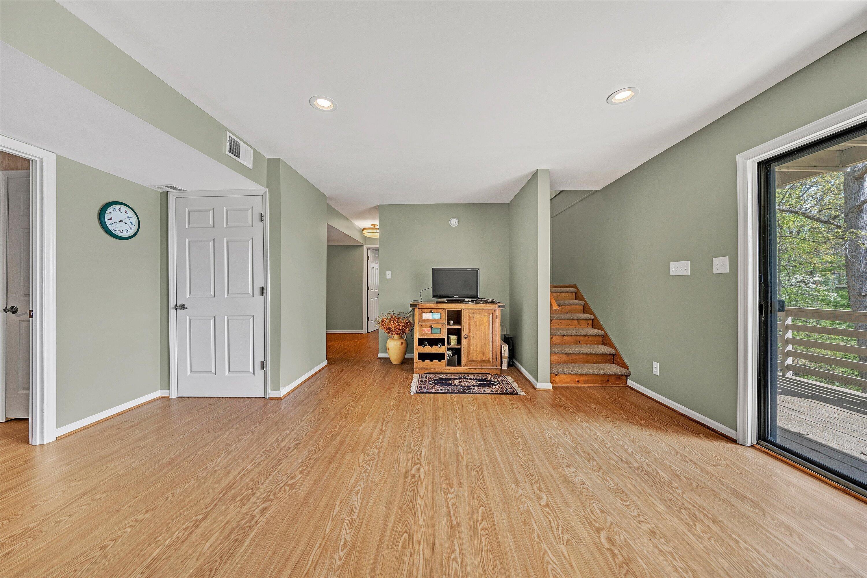 259 Brooks Point Lane Union Hall, VA 24176 - Photo 27 of 59 a view of a livingroom with wooden floor and stairs
