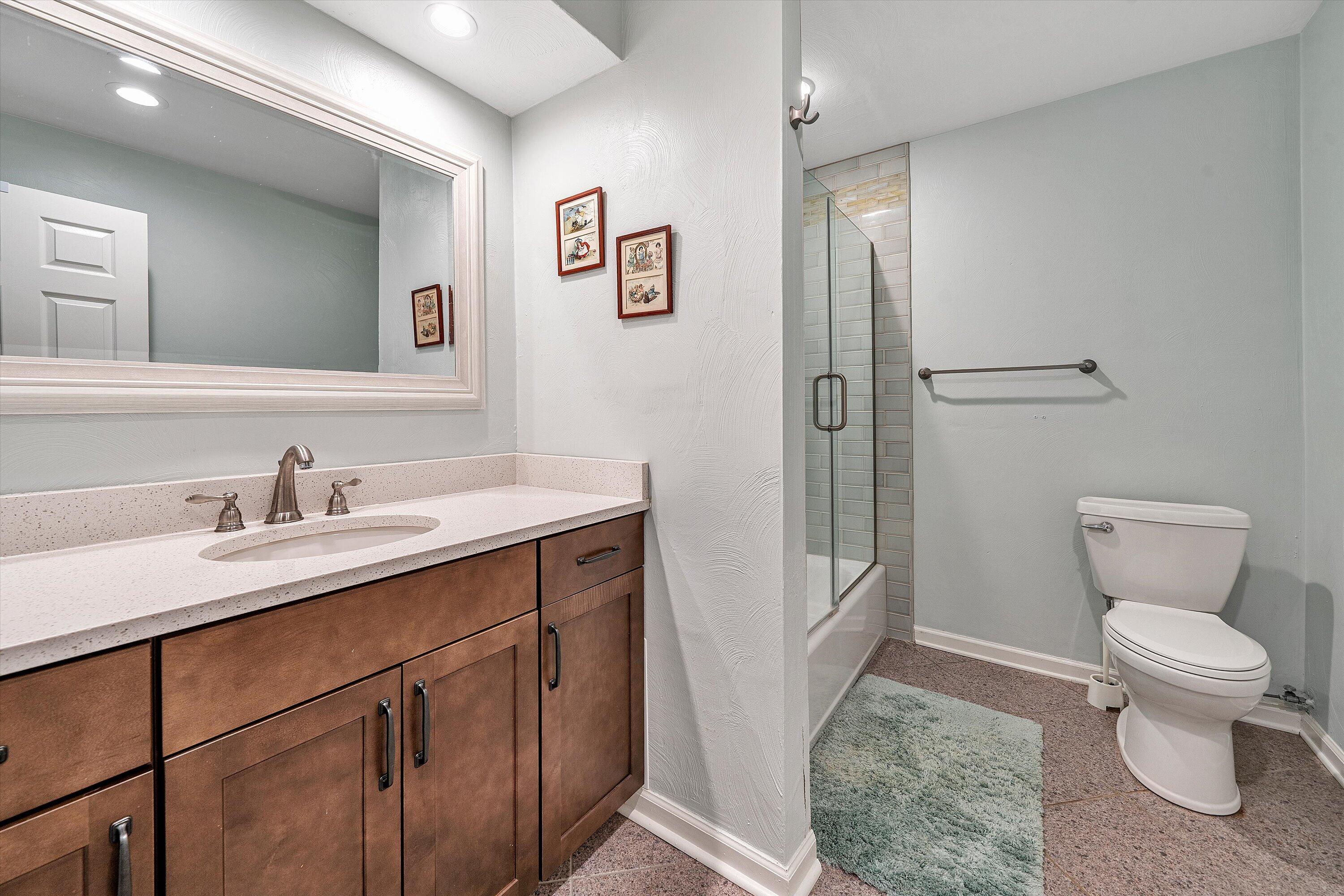 259 Brooks Point Lane Union Hall, VA 24176 - Photo 31 of 59 a bathroom with a granite countertop sink toilet and shower