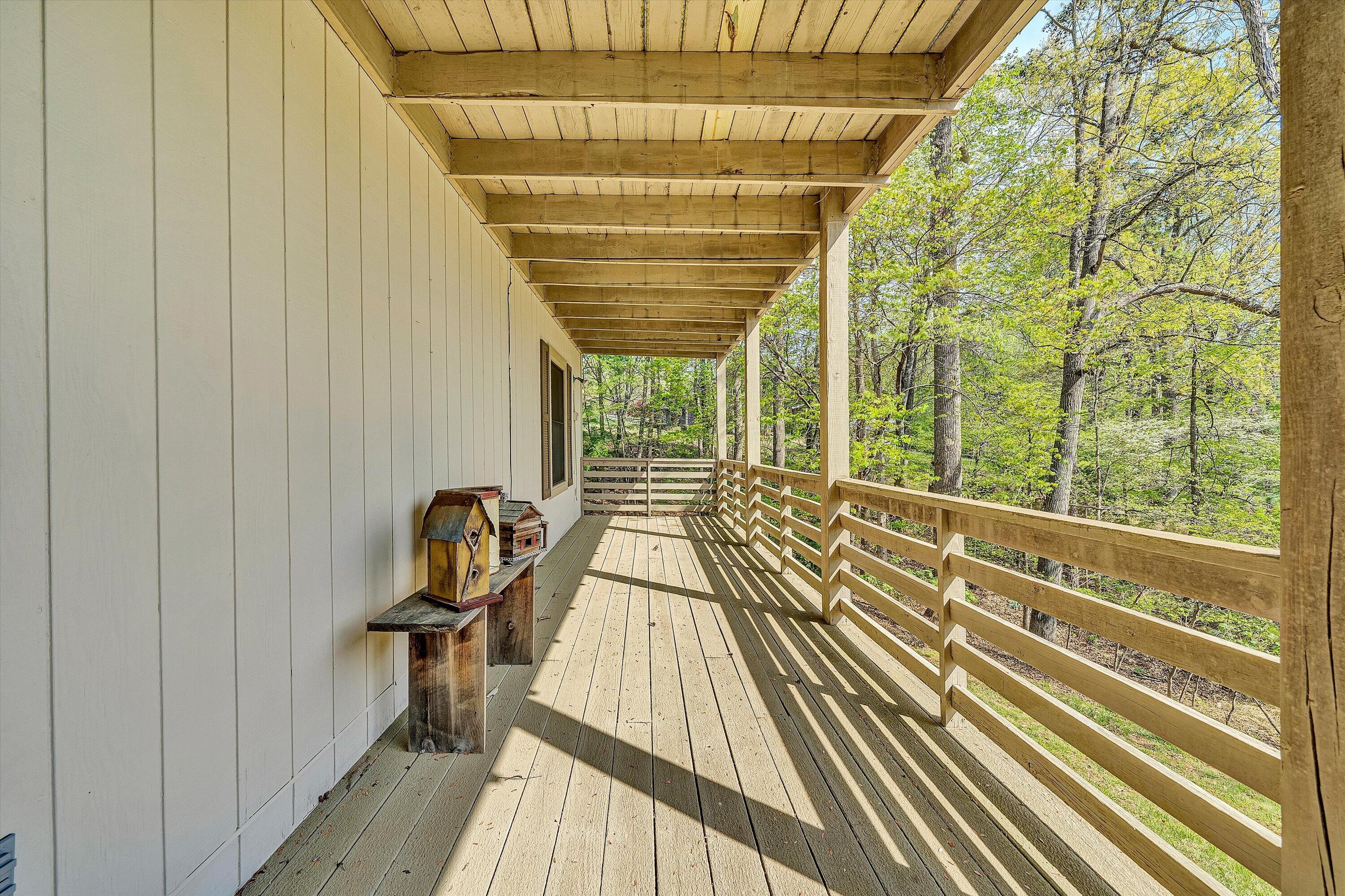 259 Brooks Point Lane Union Hall, VA 24176 - Photo 34 of 59 a view of a balcony with wooden floor and iron stairs