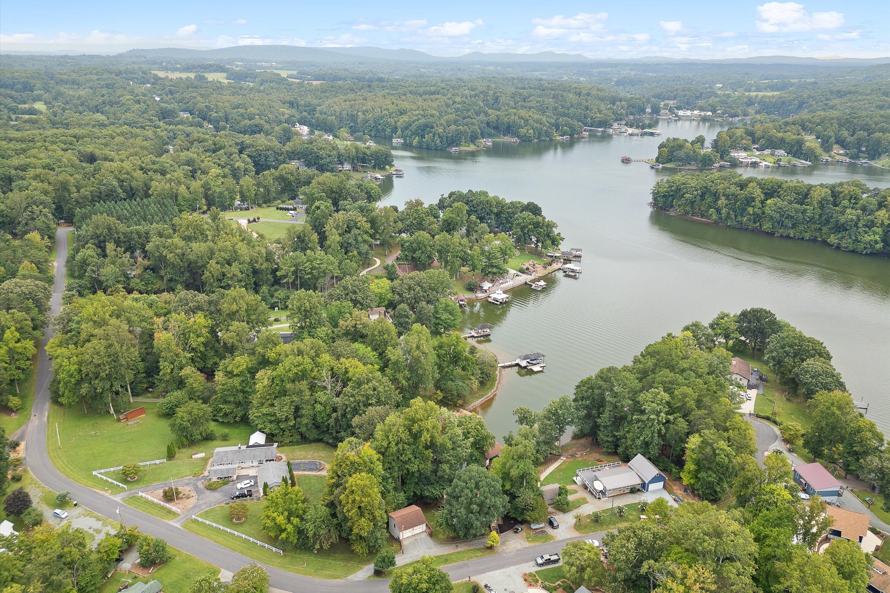 259 Brooks Point Lane Union Hall, VA 24176 - Photo 45 of 59 an aerial view of lake residential house with outdoor space and trees around
