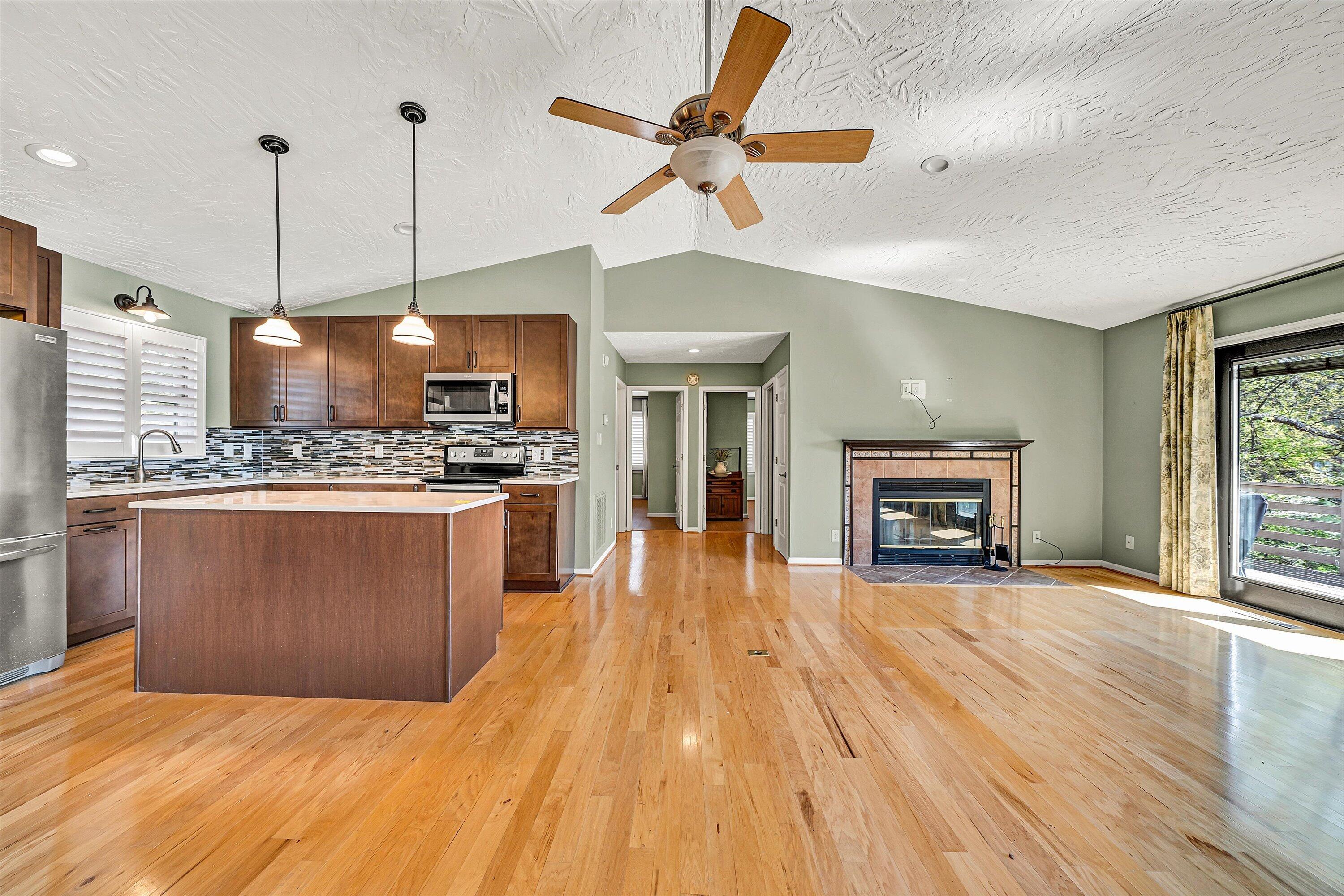 259 Brooks Point Lane Union Hall, VA 24176 - Photo 10 of 59 a open kitchen with stainless steel appliances granite countertop a refrigerator a stove and a wooden floors