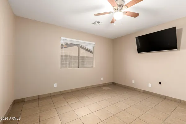 a view of an empty room with a flat screen tv