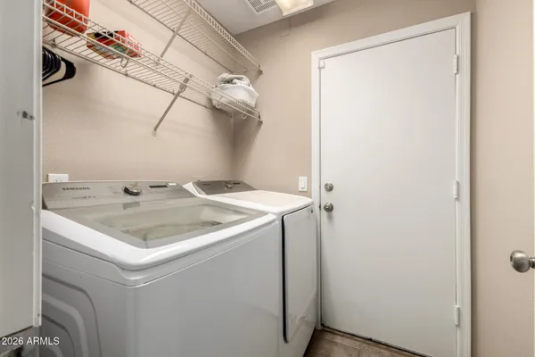 a utility room with dryer and washer