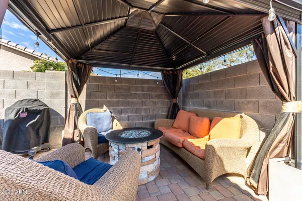 a outdoor space with patio furniture and a fireplace