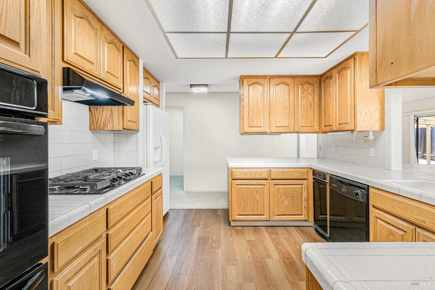 138 Oak Shadow Drive Santa Rosa, CA 95409 - Photo 16 of 50 a kitchen with stainless steel appliances granite countertop a stove a sink and a microwave