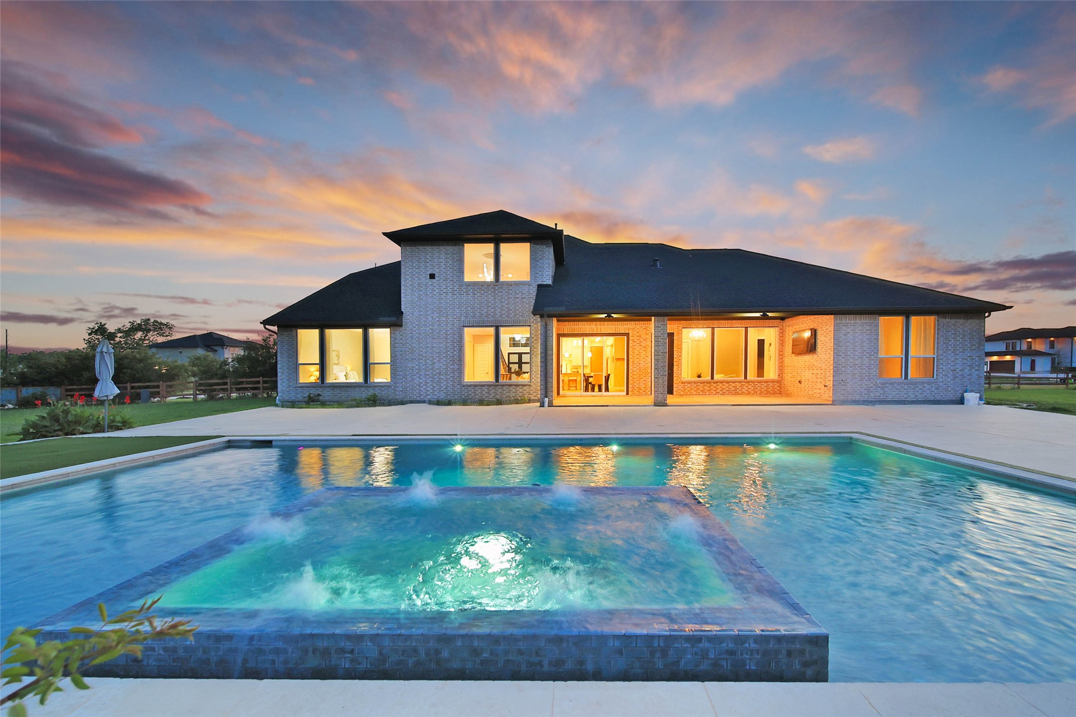 29402 Cir S Rnch Trail Fulshear, TX 77406 - Photo 41 of 50 Ready for a swim? This modern-designed (chlorine) pool and spa were built in 2023 by Sunset Pools, offering a fresh, contemporary feel. It’s the perfect backyard retreat for relaxation and fun. Its depth measures from 3-9ft.
