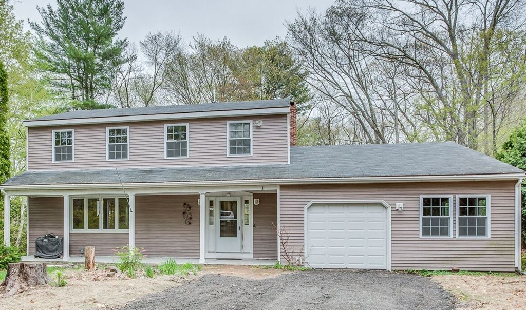233 Middle Road Newbury, MA 01922 - Photo 1 of 30 a front view of a house with a yard and garage