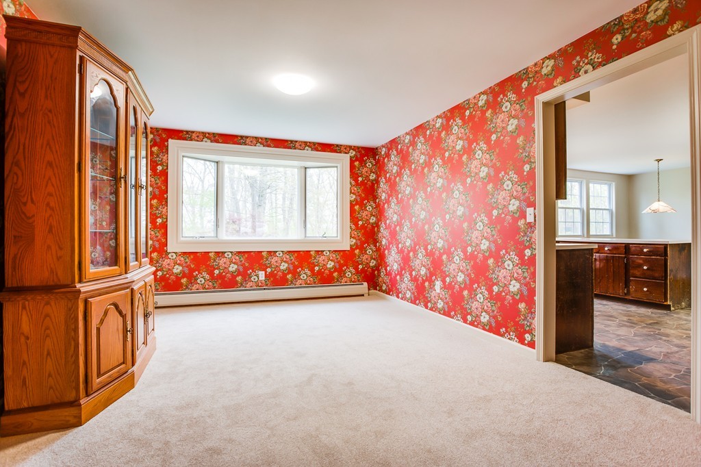 233 Middle Road Newbury, MA 01922 - Photo 13 of 30 wooden floor in an empty room with a window