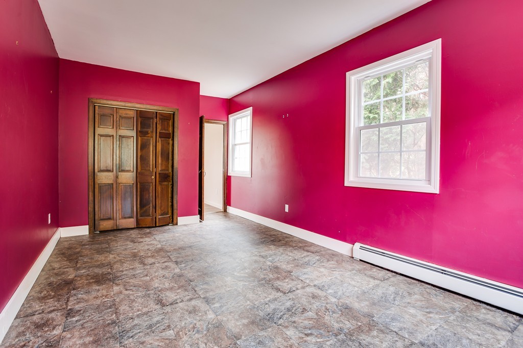 233 Middle Road Newbury, MA 01922 - Photo 15 of 30 a view of an empty room with wooden floor and a window