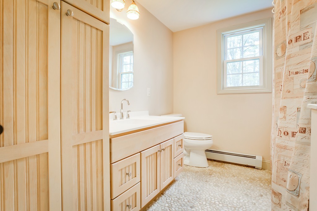 233 Middle Road Newbury, MA 01922 - Photo 22 of 30 a bathroom with a sink a toilet and shower